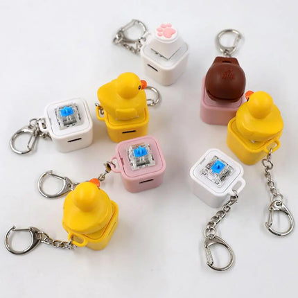 Rechargeable Cartoon Yellow Duck Shaft Tester Keychain With LED Light Fidget Button Finger Toys Fun Keyboard Toy Gifts